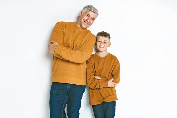 Father and son having fun together on studio white — Stock fotografie
