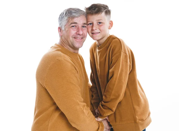 Father and son having fun together on studio white — Stock fotografie