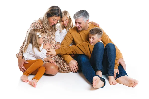 Happy husband and kids with pregnant wife on white background — ストック写真