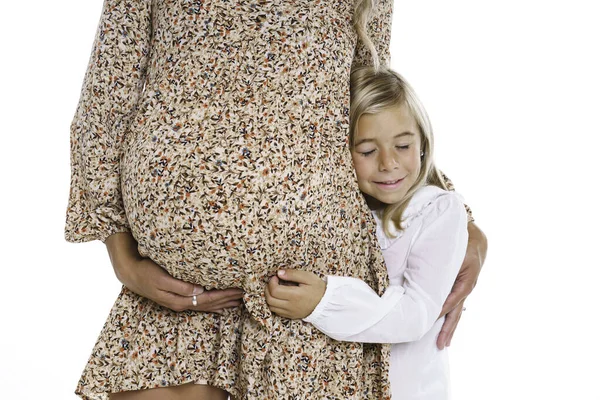 Young pregnant woman with child touch belly — Stockfoto