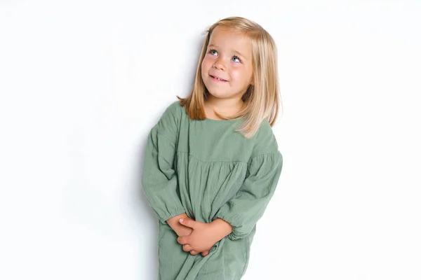 Little child smiling and looking at camera on studio — Fotografia de Stock