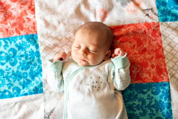 A Little Newborn Sleeping on the parent bed — Zdjęcie stockowe
