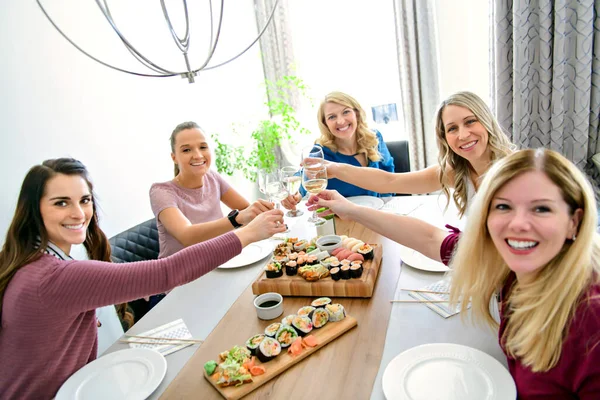 Group of attractive mature people eating sushi at home —  Fotos de Stock
