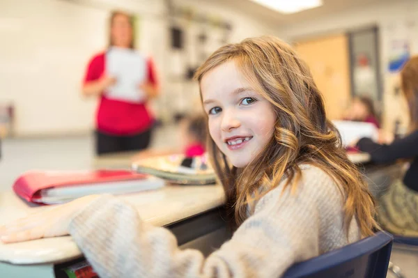 Education and school concept little student girl studying at school — Foto de Stock