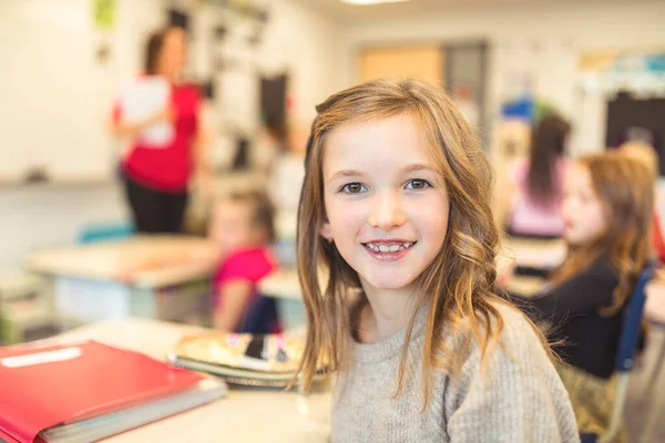 Education and school concept little student girl studying at school — Foto de Stock