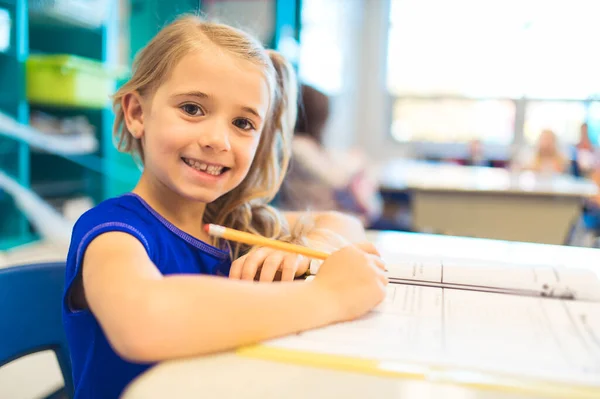 Education and school concept little student girl studying at school — Photo