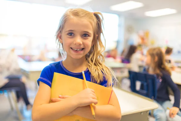 Education and school concept little student girl studying at school — Photo