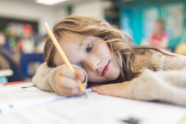 Education and school concept little student girl studying at school — Stock Fotó