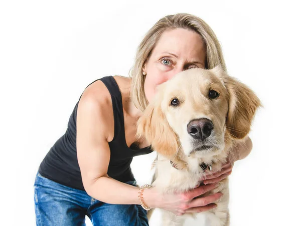 Nice woman and her beautiful Golden Retriever dog over white background — стоковое фото