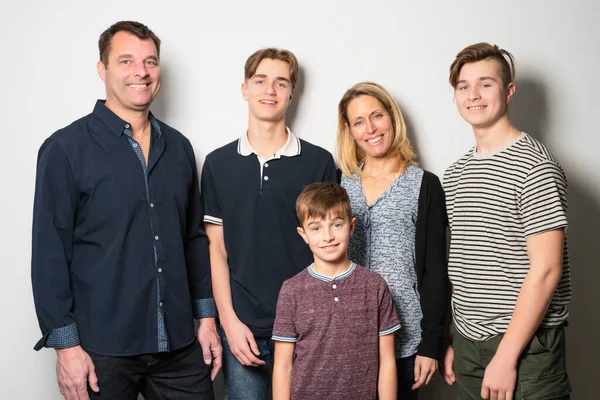 A Beautiful happy family over a white background — Stockfoto