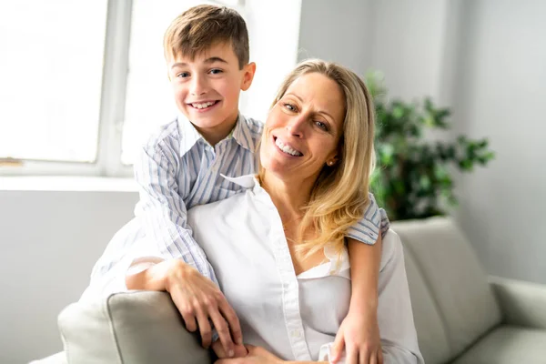 A people and family happy boy with mother on sofa at home — ストック写真