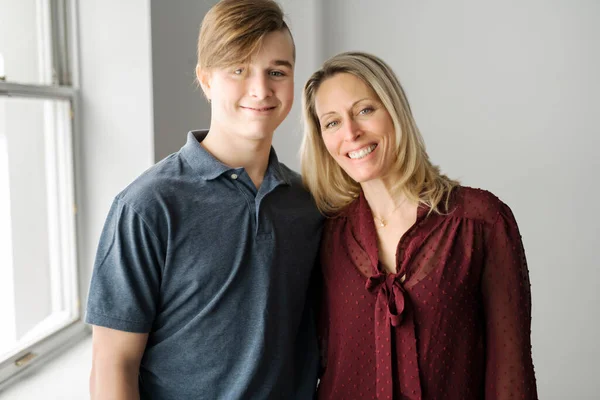 A people and family happy teen boy with mother at home — ストック写真