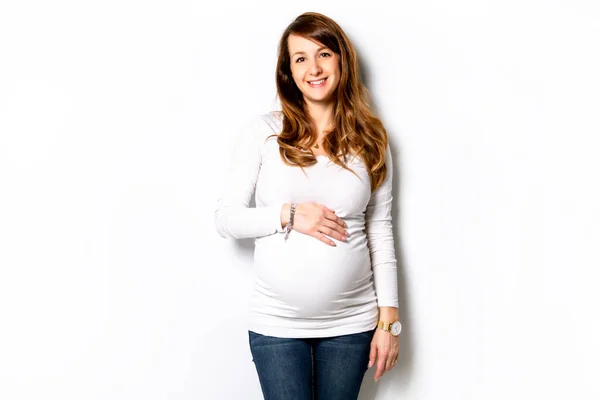 A Portrait of adorable pregnant woman in white — Foto Stock