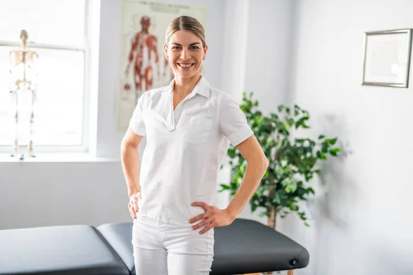 A Modern rehabilitation physiotherapy woman worker at job — ストック写真