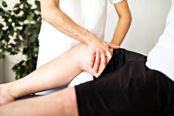 A Modern rehabilitation physiotherapy woman worker with client — Stock Photo, Image