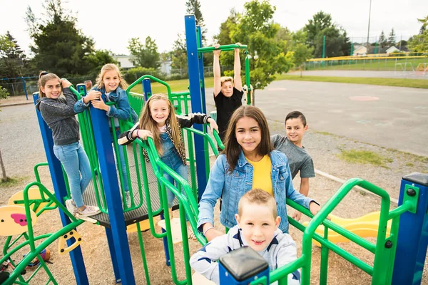 A group of Happy childrens play on the school playground — Photo