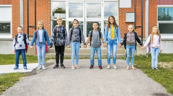 Group of kids on the school background having fun — Stock Photo, Image