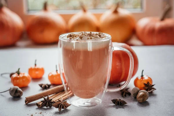 Pumpkin spiced latte with whipped cream and cinnamon