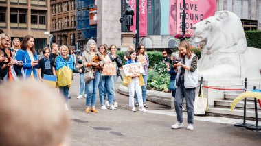 Glasgow, Scotalnd - July 30, 2022 children performing at Anti-Russia protest with participants calling for Russia to be recognised as a terrorist state, war in Ukraine