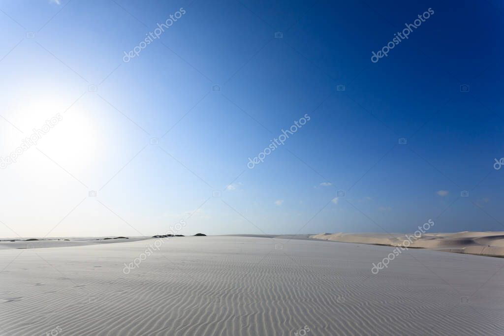 White sand dunes panorama from Lencois Maranhenses National Park, Brazil. Rainwater lagoon. Brazilian landscape