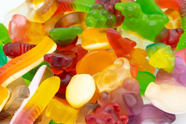 Close up of assorted jelly sweets, mixed colorful gummy candies