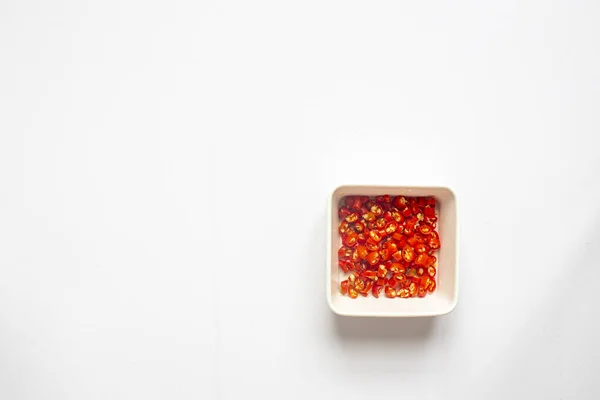 Chopped Chili Peppers White Plate White Background Top View — Stock Photo, Image