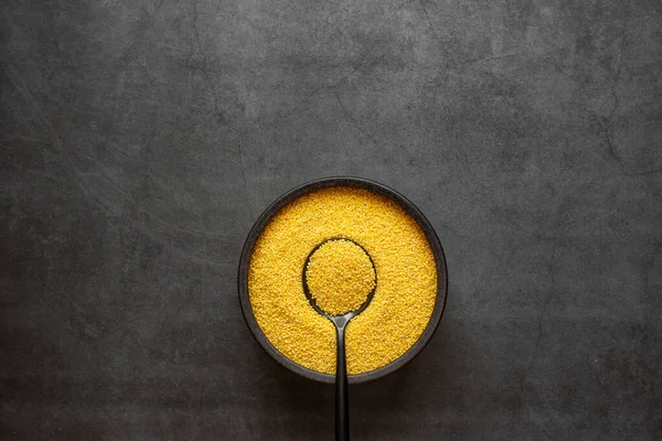 Yellow Millet Spoon Bowl Dark Grey Background — Stock Photo, Image