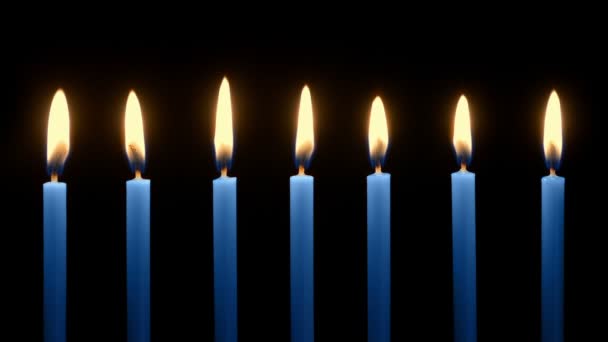 Blue Candles Row Burning Dark — Stock Video