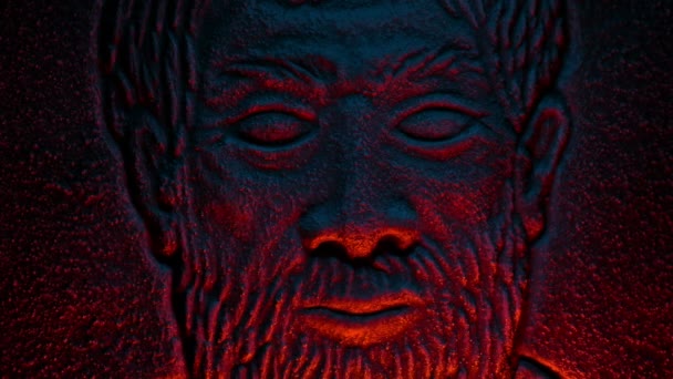 Man Face Stone Carving Lit Fire Glow — Stock video