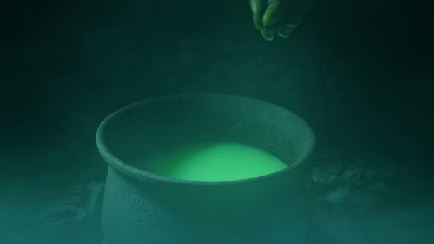 Scary Hand Making Potion Smoky Cave — Stock Video
