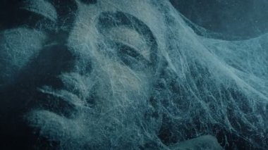 Dust Swirls Around Ancient Temple Statue