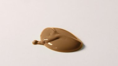 Blob Of Brown Paint Falls Closeup