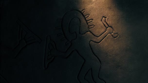 Flashlight Shines Ancient Astronaut Depiction Wall — Stock Video