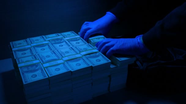 Thief Loads Bag Money Blue Security Light — Vídeos de Stock