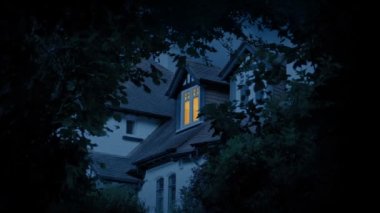 Bedroom Light On In House In The Evening Framed By Trees