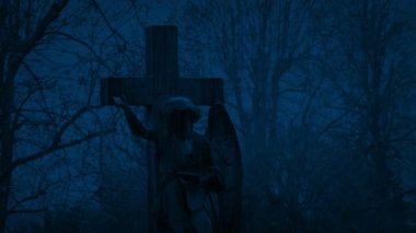 Angel Statue In Snowfall At Night
