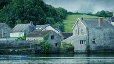 Day To Night Transition Of Houses By The River