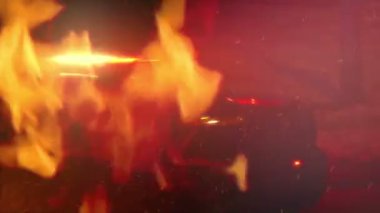 Fire Near Police Car With Flashing Lights