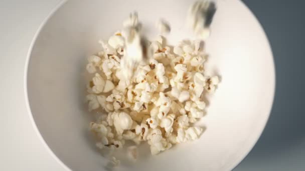 Popcorn Poured Bowl Overhead Shot — Vídeos de Stock