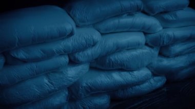 Drug Bags Piled Up In Dark Room