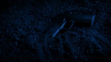 Gun On The Floor At Night
