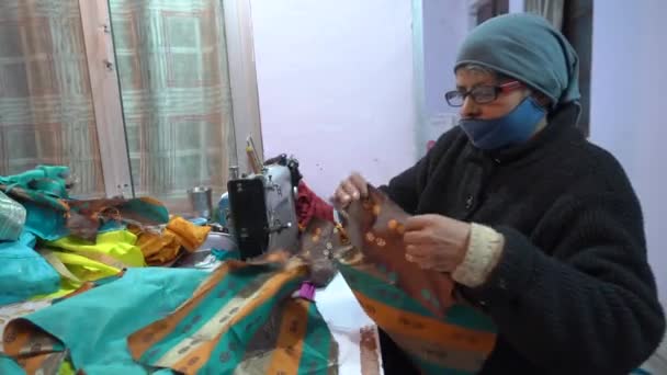 Indian woman of rural India sew clothes at their home in village, region of Himalayas — Stock Video