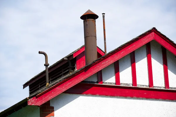 Flue chimney fixed to building exterior slate roof — Stock Photo, Image