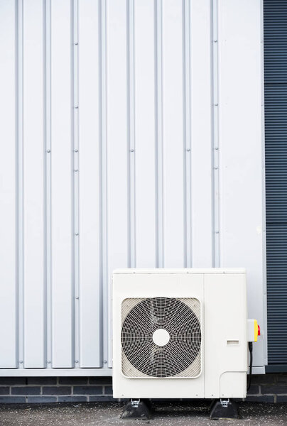 Heat pump condenser units for heating and cooling modern building UK