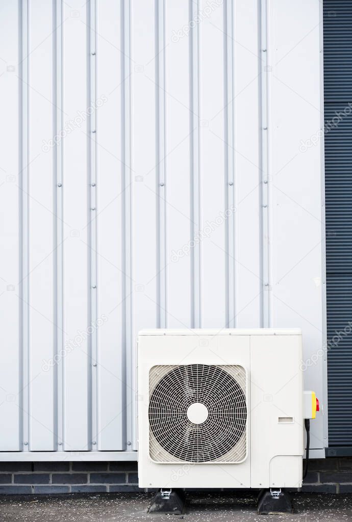 Heat pump condenser units for heating and cooling modern building UK
