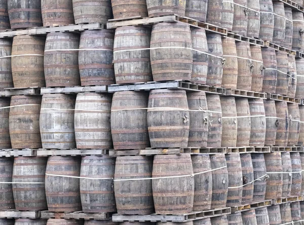 Whisky casks stacked at distillery for storage UK