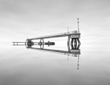 Old derelict wooden jetty pier in sea at Inverkip power station UK
