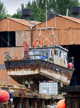 Boat at shipyard for repair at Clynder in Argyll and Bute UK