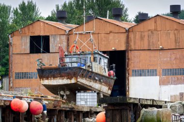 Boat at shipyard for repair at Clynder in Argyll and Bute UK
