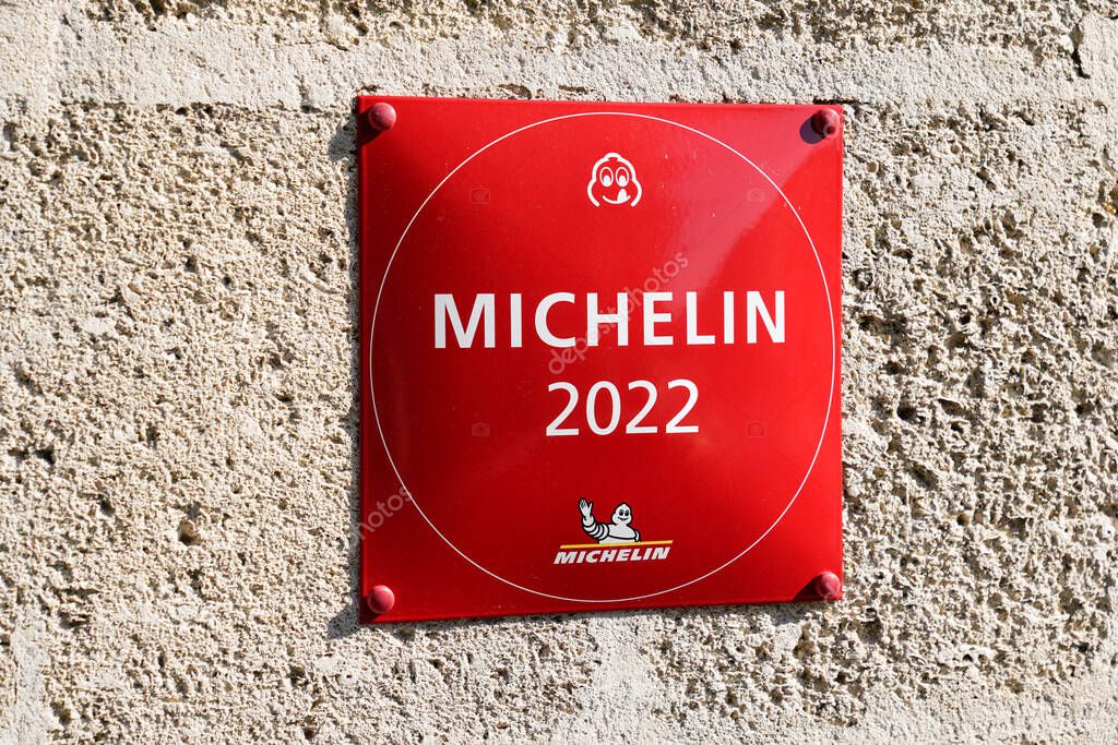 Bordeaux , Aquitaine France - 10 20 2021 : Michelin 2022 red star book Guide plate text sign with logo brand on good Restaurant Wall building